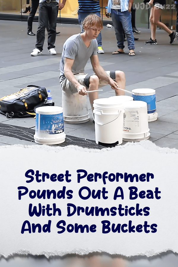 Street Performer Pounds Out A Beat With Drumsticks And Some Buckets
