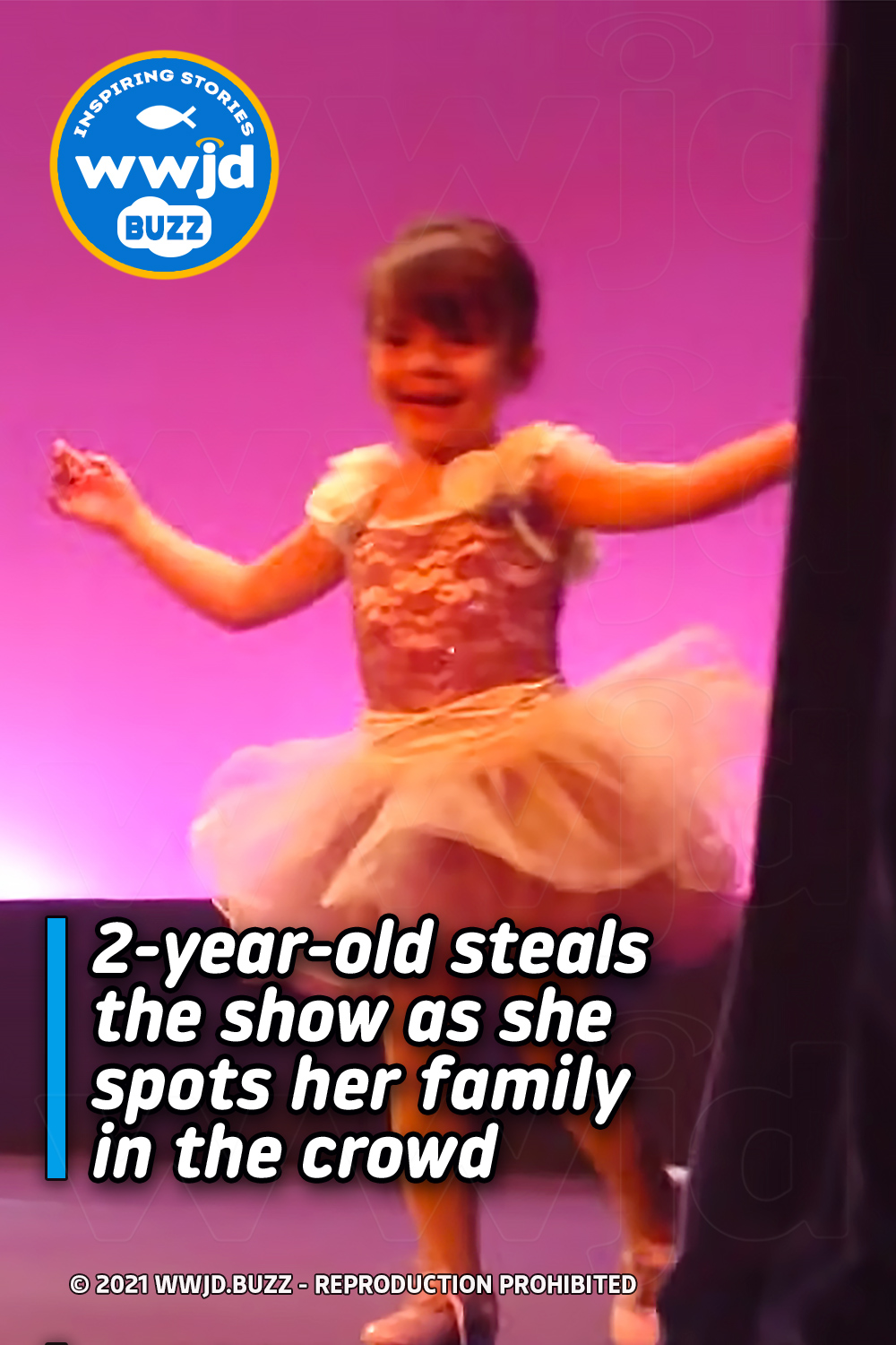 2-year-old steals the show as she spots her family in the crowd