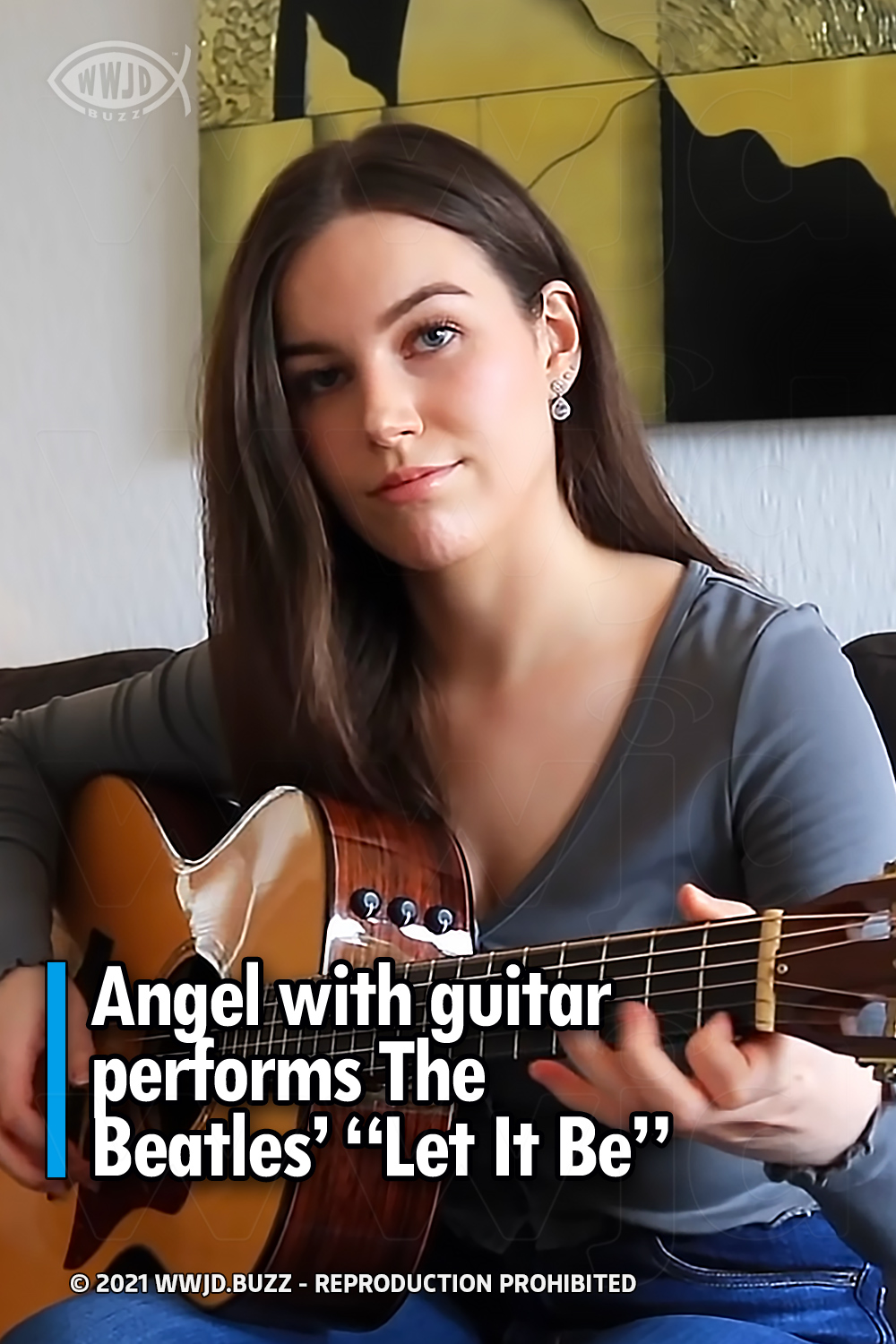 Angel with guitar performs The Beatles’ “Let It Be”