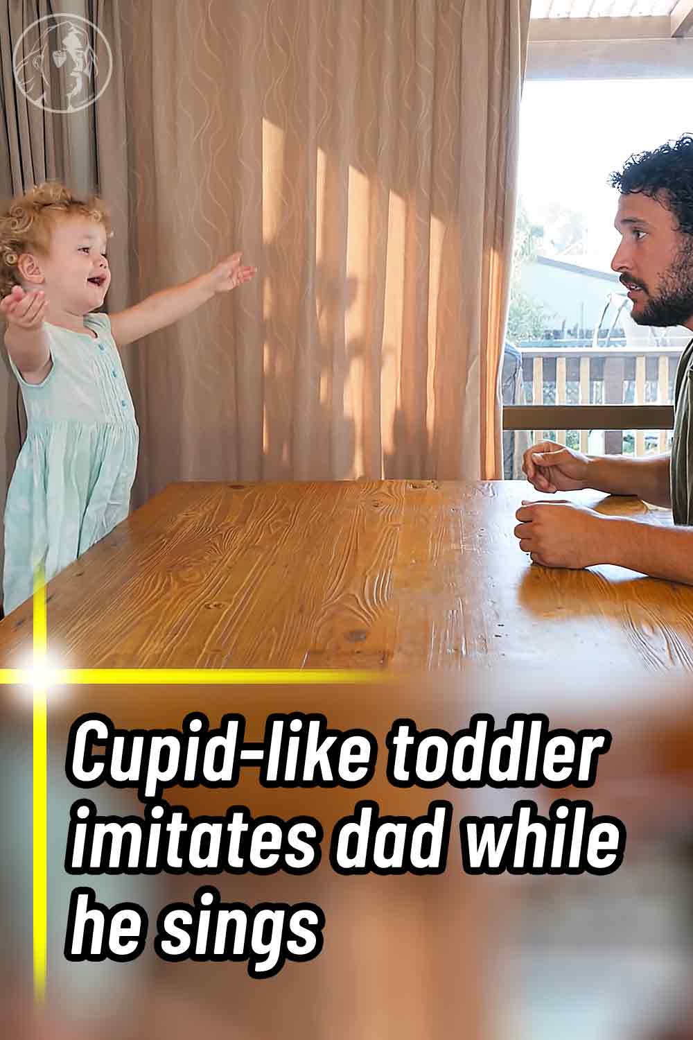 Cupid-like toddler imitates dad while he sings